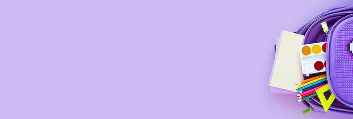 Back to school concept. Backpack with school supplies. Top view.