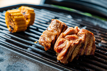 grilled pork chop and corn