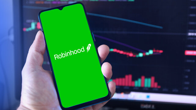 Robinhood logo on smartphone screen with a chart of stock prices. Moscow, Russia - Jule 10, 2022.