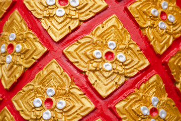 Stucco designs in Thai art are popularly adorned on the statue in the trousers section.