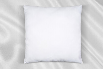 Obraz premium Square White Throw Pillow Mockup on Silk Background
