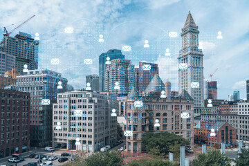 Financial downtown city view panorama of Boston from Harbor area at day time, Massachusetts. Glowing Social media icons. The concept of networking and establishing new connections between people