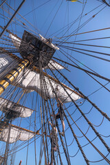 Sailors climbing the rig on the replica of the old Indian Man Götheborg, at the pier Skeppsbron in...