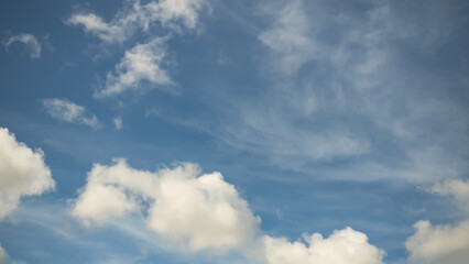 Obraz premium Blue sky white cloud background. sunlight day with sky wallpaper backdrop. mockup nature landscape free space backdrop. card or poster for environment protection.