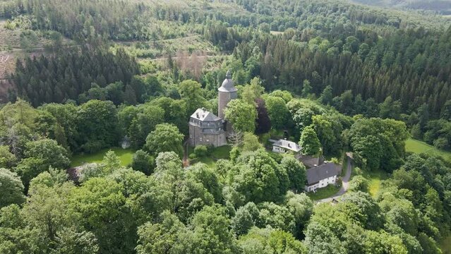 drone footage of  Wildenburg Castle in the southeast of the village of Friesenhagen in the North Rhine-Westphalia region of Germany.