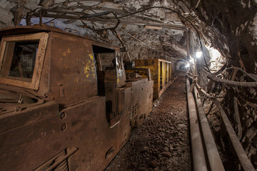 Fototapeta na wymiar Old rusty train in iron ore mine