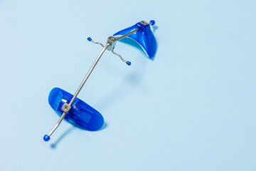 Orthodontic face mask Dental Petite Mask on a blue background