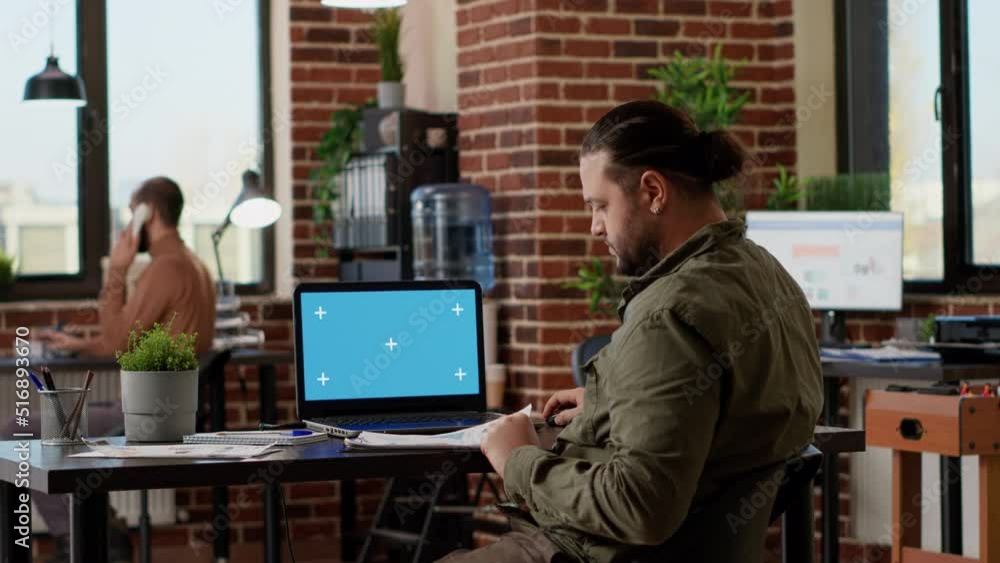 Aufkleber businessman looking at greenscreen on wireless laptop in company office, using computer with mockup 