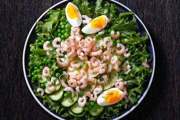 pink cocktail shrimps salad with veggies on plate