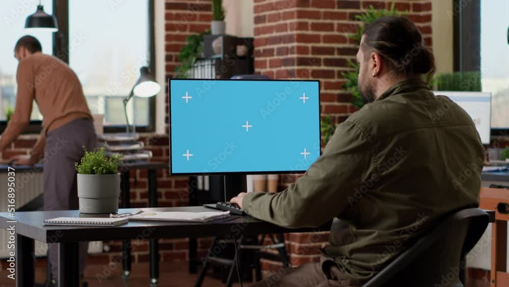 Poster office employee typing on computer with greenscreen, working with isolated chroma key copyspace and 