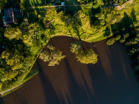 Floodwater Creeping Up Riverbank Towards Homes And Backyards