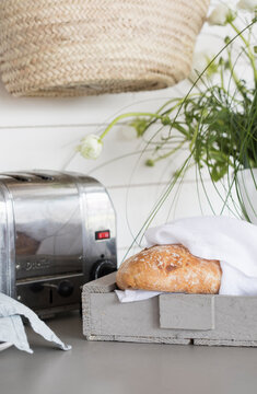 Loaf of bread flowers and toaster