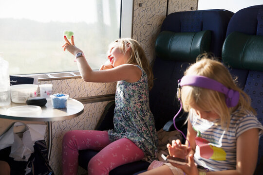 Girls sitting on moving train