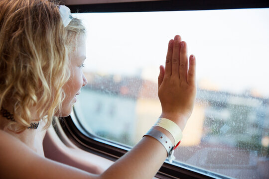 Girl at window of train