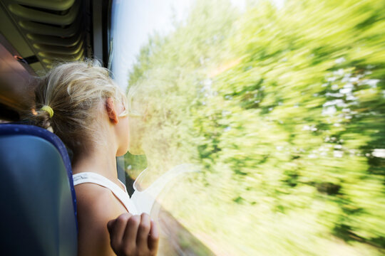 Girl leaning on train window