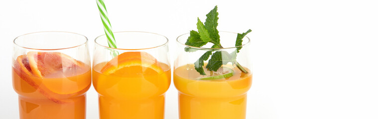 Fruit juices assortment on light background.