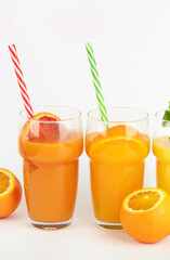Fruit juices assortment on light background.
