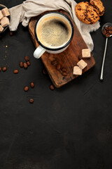 Fototapeta na wymiar Cup of black coffee on dark background.