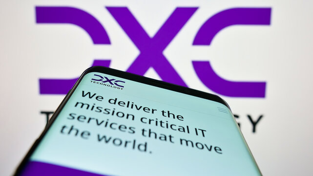 Stuttgart, Germany - 07-10-2022: Mobile phone with website of American IT consulting firm DXC Technology Company on screen in front of logo. Focus on top-left of phone display.