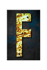 Fototapeta premium Letter F. Alphabet from letters, from rusty iron, on a wooden plank. Isolated on white background. Education. Design