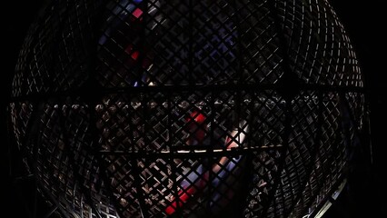 Motorcycle stunts riding inside of Globe of Death, Extreme performace, Zoom in Shot