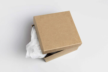 Cardboard craft box. Mailbox isolated on a white background. Open rectangular small brown box for transporting goods isolated on a white background, front view. Recycled paper.