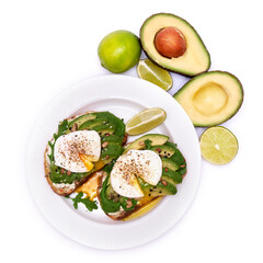 Freshly made poached egg and Avocado toasts isolated on white background