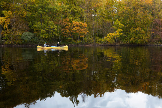 Two men kayaking on river