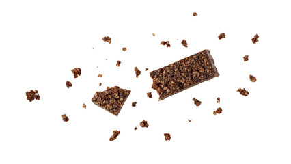 Tasty broken healthy bar from whole oat grain and chocolate  with crumbs flying isolated on white...