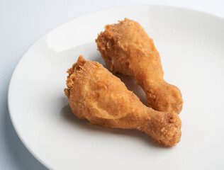 Fried chicken drumsticks isolated on white background