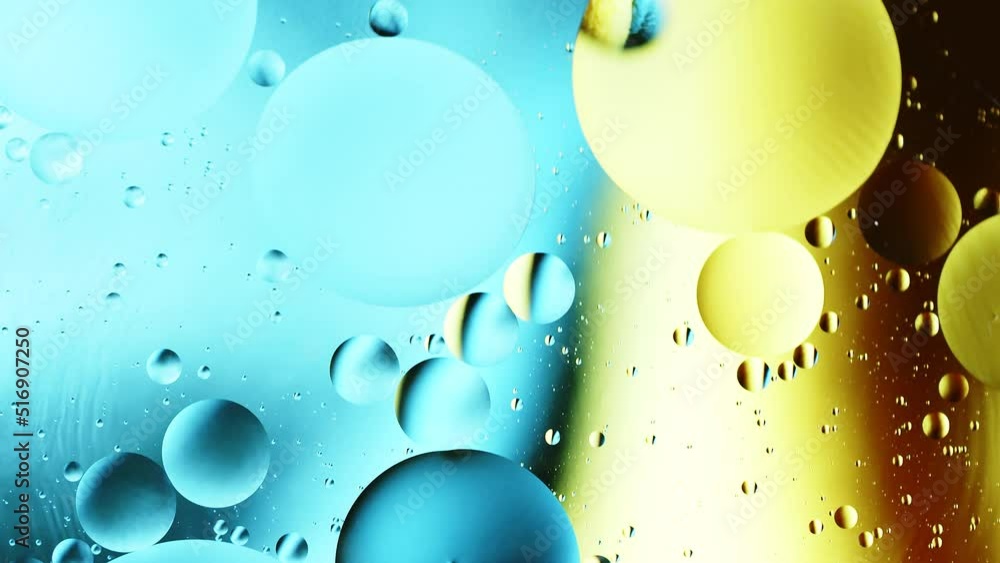 Aufkleber real close up oil bubbles in water rotation with color gradient abstract mixing background.