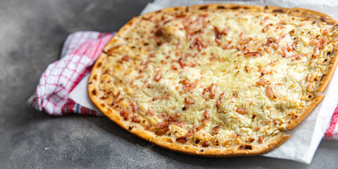 Flammkuchen savory pie bacon, onion, sour cream pastrie pie fresh meal food snack on the table copy space food background rustic