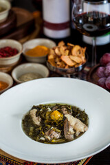 Soup with parsley, meat, lemon, spinach