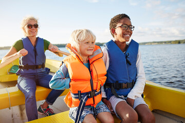 Family in boat on lake