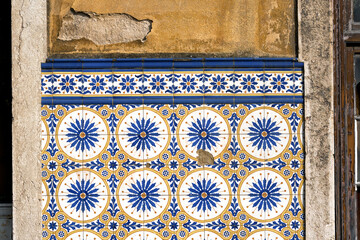 detail of a panel of azulejos tiles on the facade of an old house in Leiria, Portugal