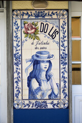 detail of a panel of azulejos tiles on the facade of an old house in Leiria, Portugal