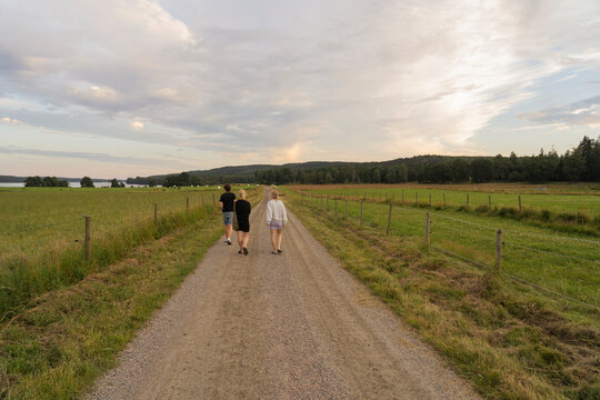 Family walking on rural road
