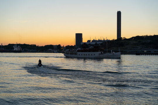 Man on jet ski and boat on River Gota Gothenburg Sweden