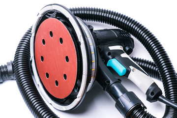 Rotary grinder with black corrugated hose for connection to a vacuum cleaner