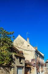 Fototapeta na wymiar Street view of Milly-la-Foret in France