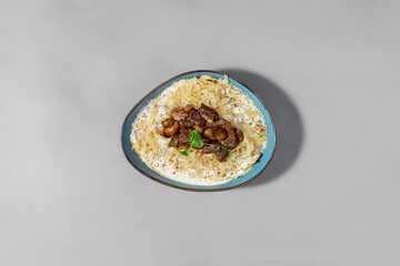 Homemade noodles with mushrooms in a creamy sauce