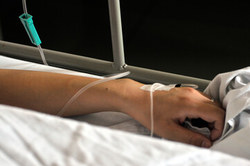 Fototapeta premium Asian women patient is on drip receiving saline solution