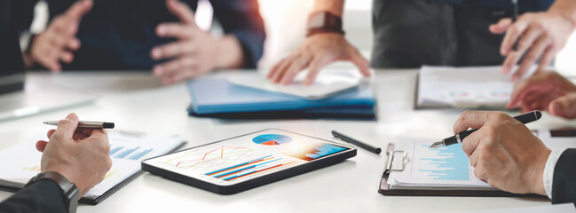 Cropped shot of diverse coworkers working together in boardroom, brainstorming, discussing and analyzing business strategy.