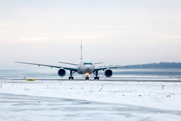 Aircraft landing on the runway of an airfield in witner