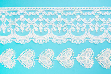 White lace with pattern on blue horizontally