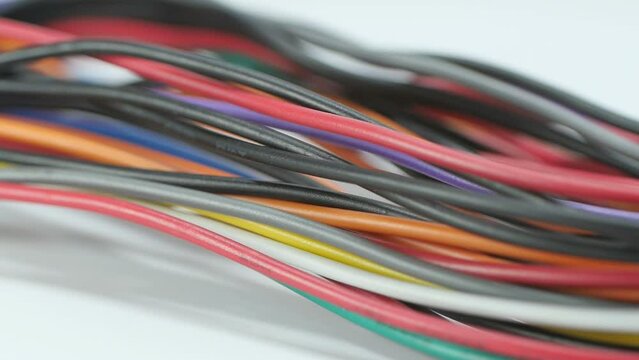 multicolored wire cable of usb and adapter isolated on white background.Electronic Connector.Selection focus.Slow motion macro footage.