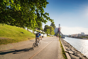Fototapeta na wymiar Cyclist by waterfront in Stockholm Sweden