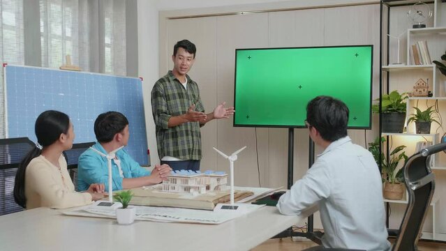 Asian Man Engineer With Solar Cell Succeed Presenting About The Green Screen Tv At The Office, Audience Clapping Hands And Feeling Impressive
