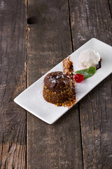 Chocolate fudge with cherries, mint ice cream scoop