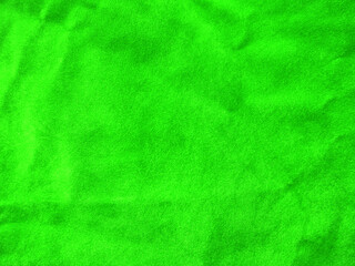 Green velvet fabric texture used as background. Empty green fabric background of soft and smooth...